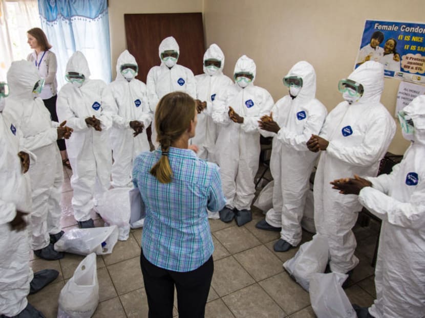 A World Health Organisation, WHO, worker, centre, trains nurses to use Ebola protective gear in Freetown, Sierra Leone, Thursday, Sept 18, 2014. Photo: AP