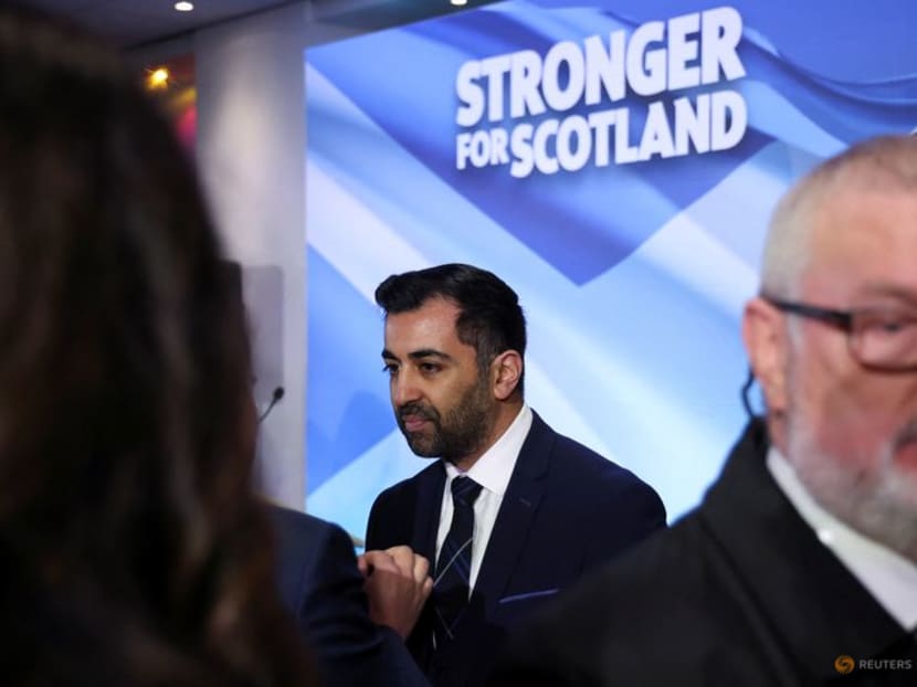 Humza Yousaf speaks with a person after being announced as the new Scottish National Party leader in Edinburgh, Britain March 27, 2023. REUTERS/Russell Cheyne