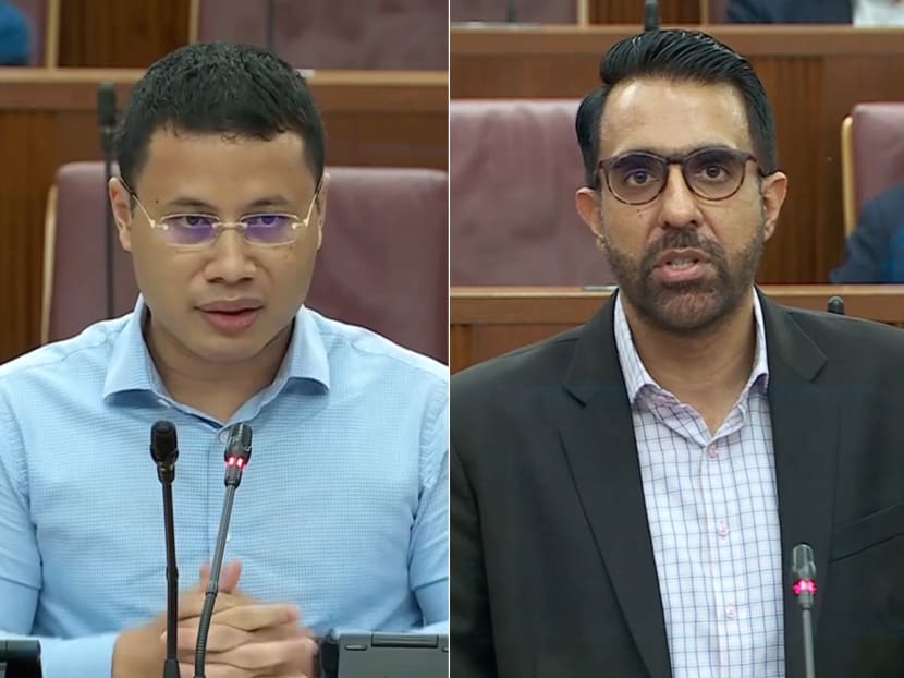 National Development Minister Desmond Lee (left) and Workers' Party chief Pritam Singh (right) in Parliament on Feb 15, 2022.