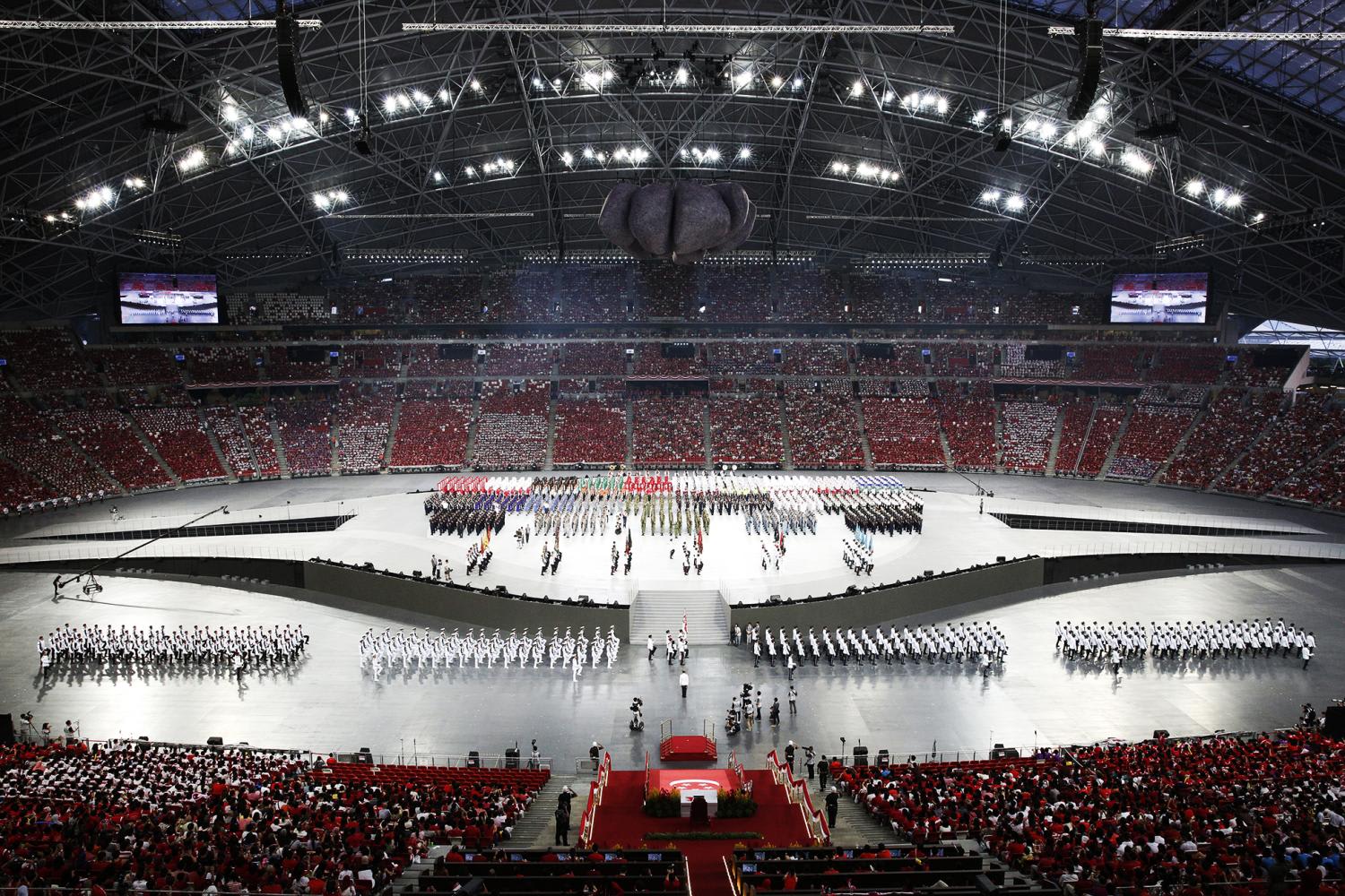 The National Day Parade in 2016 when it was held at the National Stadium within the grounds of the Singapore Sports Hub. The National Day Parade in 2016 when it was held at the National Stadium within the grounds of the Singapore Sports Hub.