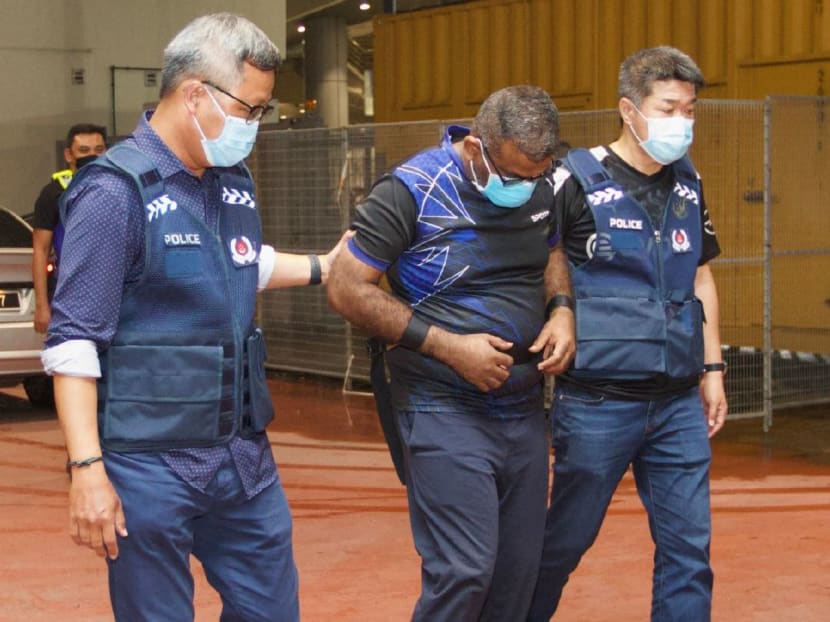 Caleb Joshua Chai Shanmugam (centre) was handed over from the Royal Malaysia Police to the Singapore Police Force on Nov 16, 2022. Caleb Joshua Chai Shanmugam (centre) was handed over from the Royal Malaysia Police to the Singapore Police Force on Nov 16, 2022.