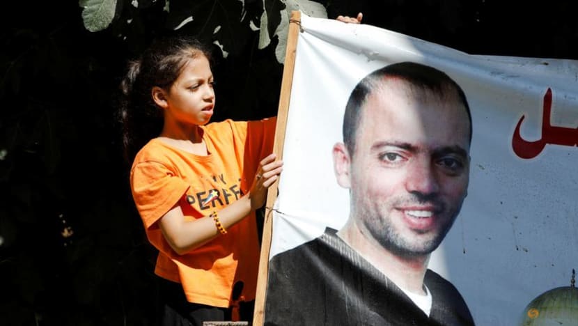 Palestinian prisoner suspends hunger strike following release deal Palestinian prisoner suspends hunger strike following release deal