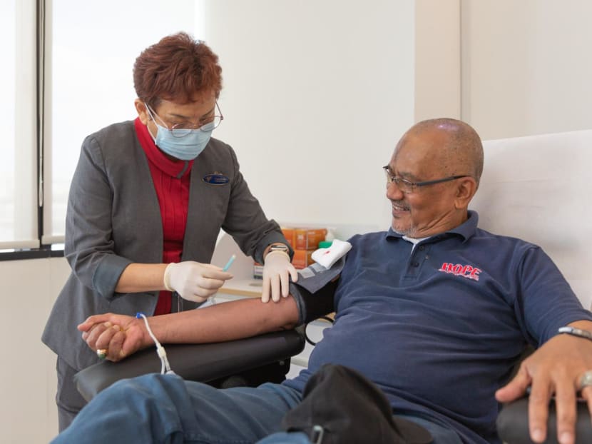 Mr Ridzwan Rahman, 64, donating blood for his 100th time on Feb 16, 2023.