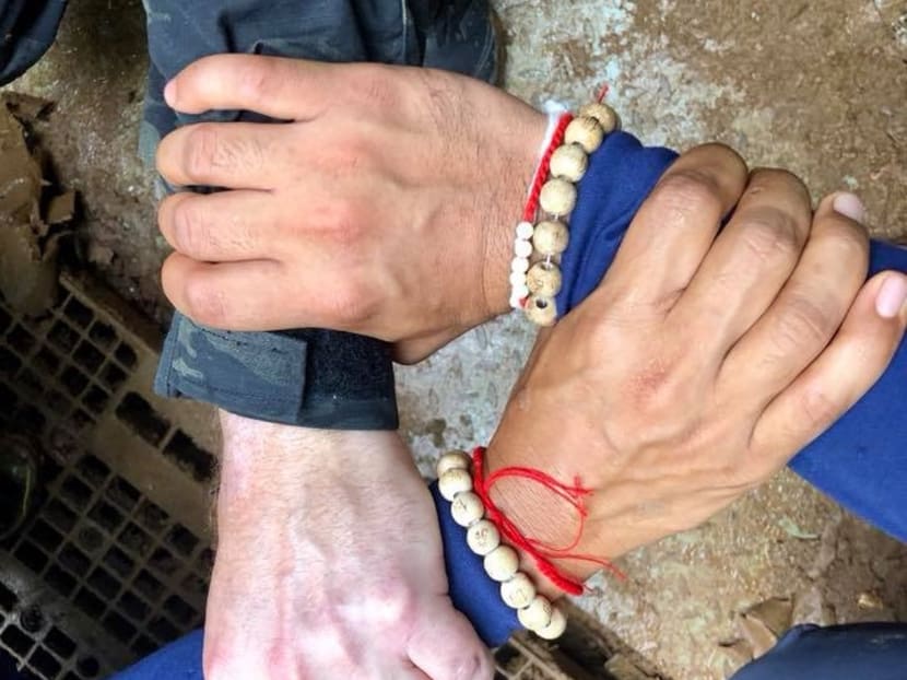 The Thai Navy SEAL posted this photo on Facebook of the hands of two Thai and one foreign rescue workers with the caption "We...the SEAL team. Team Thailand and Team International will help Team Wild Boar (name of boys' soccer team)... go home". The post has been liked almost 400,000 times since July 8.
