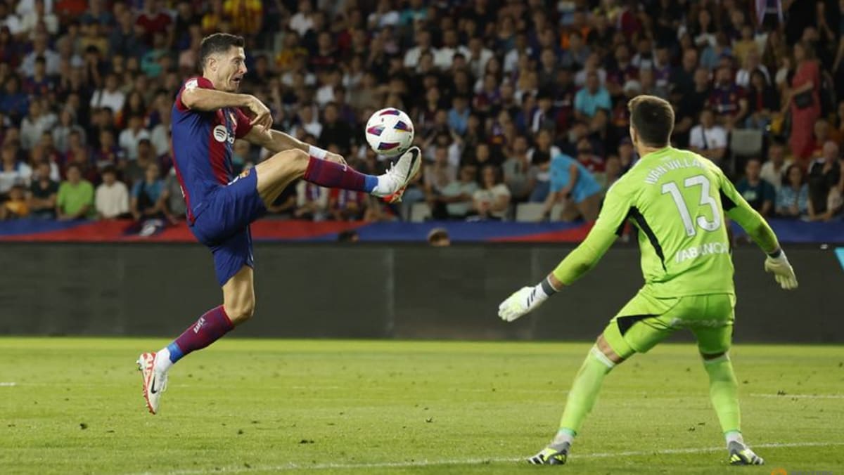 Lewandowski and Cancelo strike as Barca snatch 3-2 win over Celta