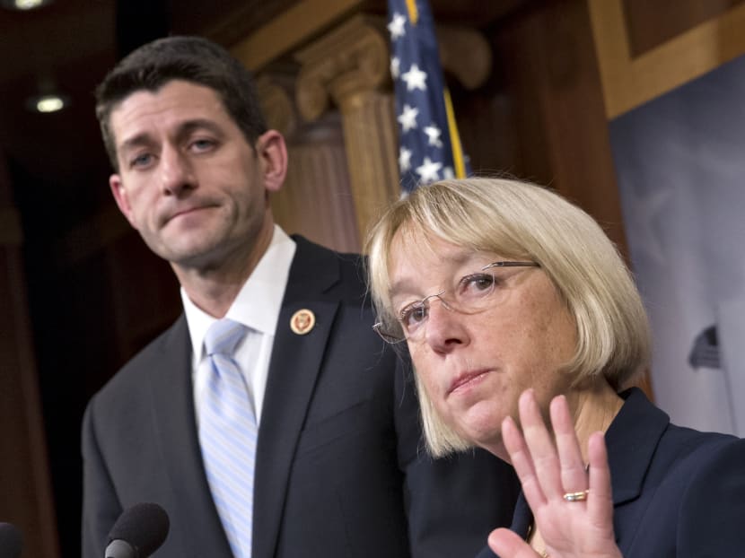 House Budget Committee Chairman Rep Paul Ryan (left) listening as Senate Budget Committee Chair Sen Patty Murray announces a tentative agreement between Republican and Democratic negotiators on a government spending plan, on Capitol Hill in Washington on Dec 10, 2013. Photo: Reuters