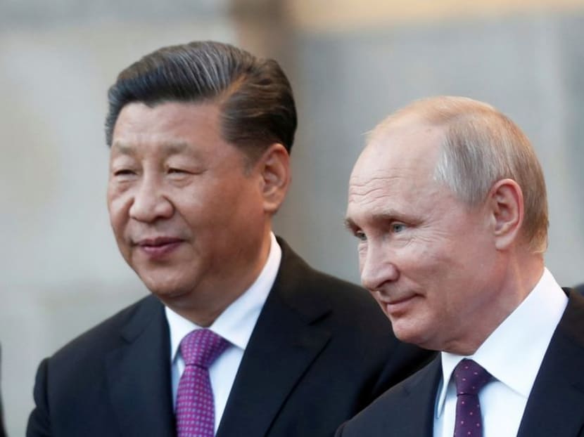 FILE PHOTO: Chinese President Xi Jinping and Russian President Vladimir Putin attend a presentation of a Haval F7 SUV produced at the Haval car plant located in Russian Tula region, at the Kremlin in Moscow, Russia, June 5, 2019. Maxim Shipenkov/Pool via Reuters//File Photo