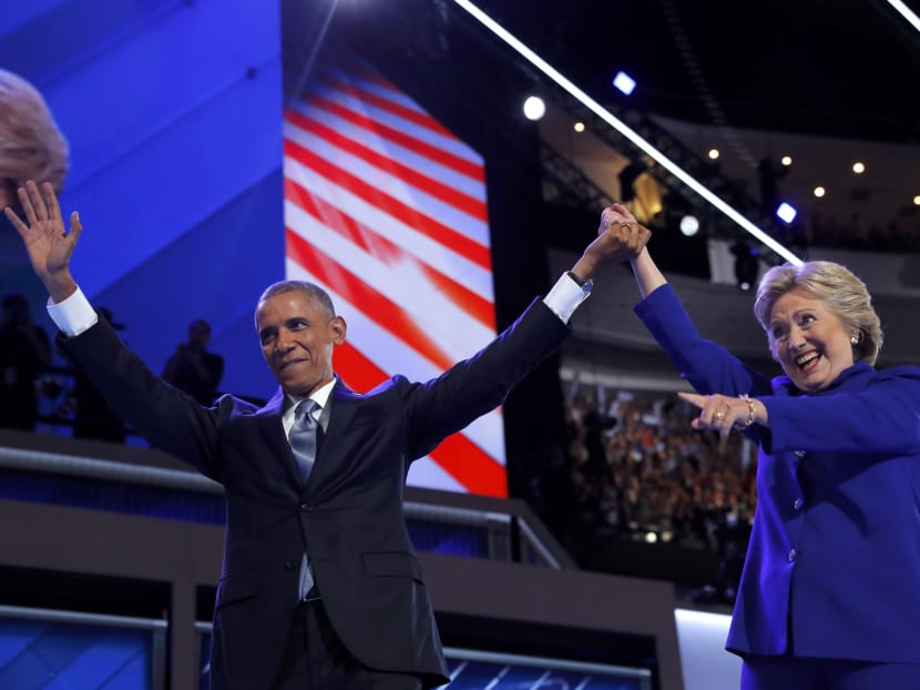 US President Barack Obama and Democratic nominee for president Hillary Clinton on stage together after Mr Obama's address at the convention on July 27. Photo: Reuters