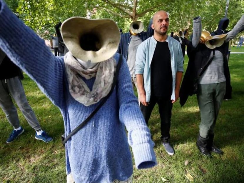 Syrian artist's Silent Demonstration watches over German war crimes trial Syrian artist's Silent Demonstration watches over German war crimes trial