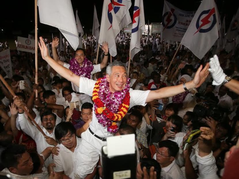 PM Lee Hsien Loong celebrates with supporters at Toa Payoh stadium on Sept 12, 2015. Photo: Ray Chua