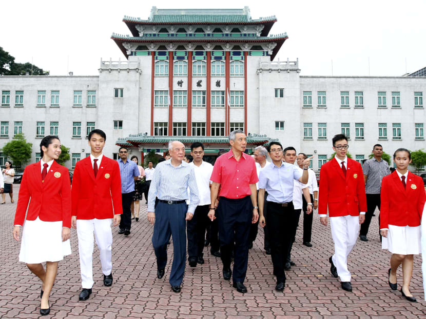 Mr Lee Hsien Loong (centre) touring Chung Cheng High School (Main) yesterday. PHOTO: ERNEST CHUA
