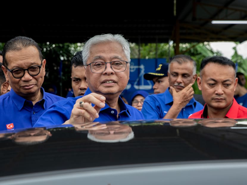 Caretaker Prime Minister Ismail Sabri Yaakob Ismail (centre) told the majority Malay audience during his rally at Ayer Hitam that they should not be swayed by Pakatan Harapan's Malay candidate Sheikh Umar Bagharib Ali. 