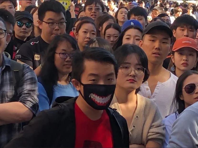 A group of pro-China students at the University of Queensland last week, before a scuffle with protesters who supported Hong Kong activists. A group of pro-China students at the University of Queensland last week, before a scuffle with protesters who supported Hong Kong activists.