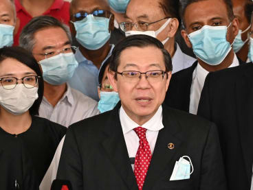 Photograph of Democratic Action Party leader and Malaysia's former Finance Minister Lim Guan Eng (centre) taken on Aug 7, 2020, after being charged with corruption. 
