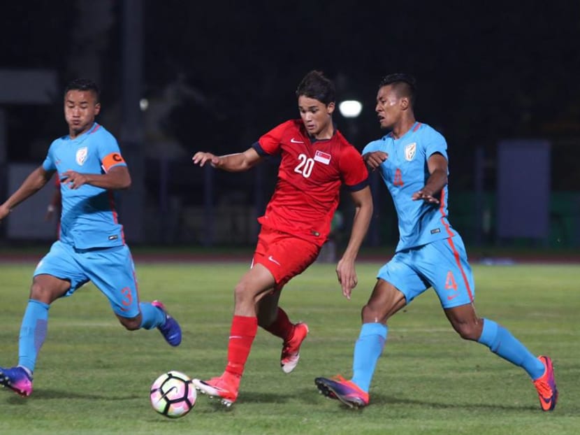 Singapore's Ikhsan Fandi trying to get past the India defence. Singapore only mustered one shot at goal throughout the entire game. Photo: Football Association of Singapore