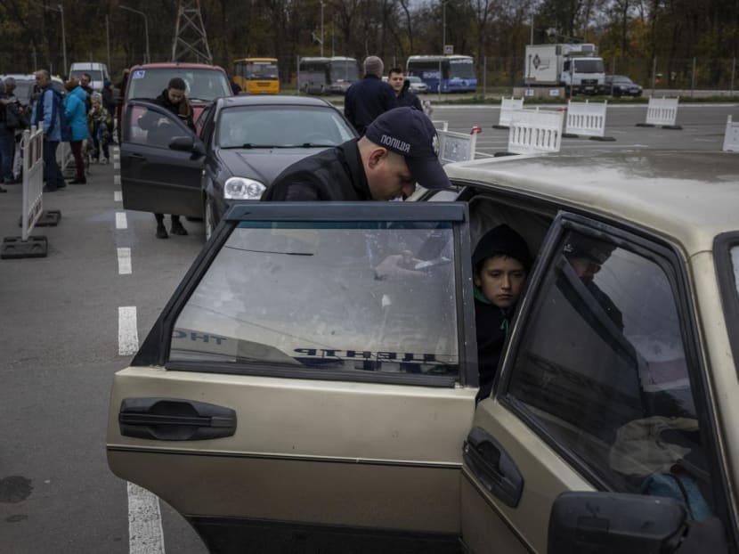 Ukrainians fleeing Russian-occupied territory in southern Ukraine having their papers checked near Zaporizhzhia, Ukraine, on Nov 2, 2022. Ukrainians fleeing Russian-occupied territory in southern Ukraine having their papers checked near Zaporizhzhia, Ukraine, on Nov 2, 2022.
