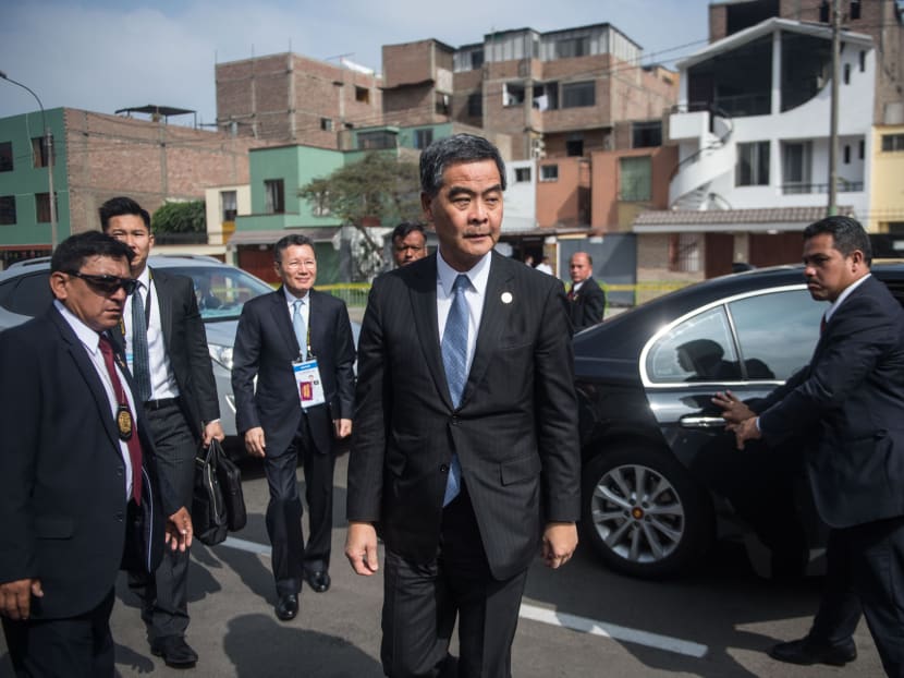 Hong Kong's Chief Executive Leung Chun-ying (C) arrives at the Lima Convention Centre to attend the APEC CEO Summit, part of the broader Asia-Pacific Economic Cooperation (APEC) Summit in Lima in this Nov 19, 2016 file photo. Photo: AFP