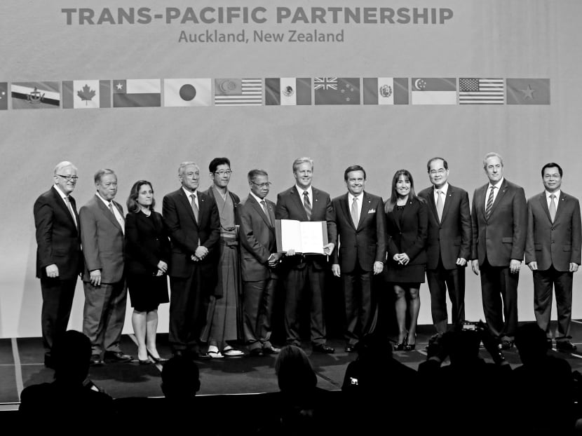Officials from the 12 signatory countries after signing the Trans-Pacific Partnership (TPP) agreement in Auckland last year. The US represents nearly 62 per cent of the TPP’s gross domestic product. Photo: AFP