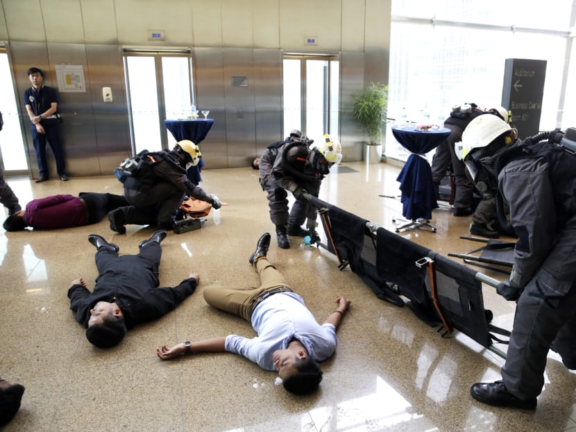 Singapore has held regular anti-terror exercises over the years. A drill on Wednesday involved a simulated chemical-agent attack at One Marina Boulevard. Photo: Wee Teck Hian
