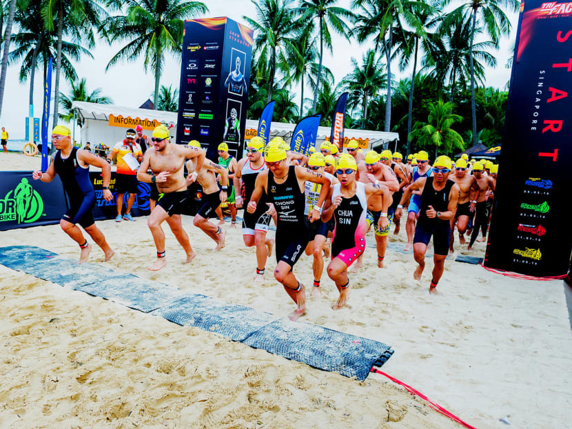 The start of the Tri-Factor Series swimming leg in 2016. Since the inaugural event in 2009, which had 3,000 entrants, it has grown steadily with more than 11,000 taking part last year. Photo: Orange Room