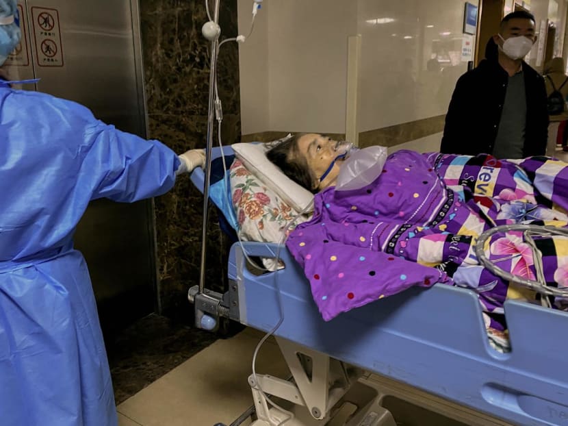 This picture shows a Covid-19 patient on a stretcher in the emergency ward of the First Affiliated Hospital of Chongqing Medical University in China's southwestern city of Chongqing on Dec 22, 2022.
