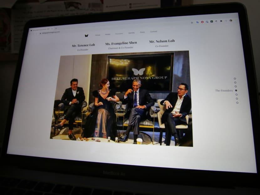 A doctored photo on the website of Bellagraph Nova Group, showing owners Terence (R) and Nelson (L) Loh and Evangeline Shen sitting next to former US President Barack Obama, is pictured on screen, August 19, 2020.