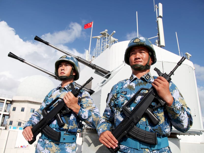 Soldiers of China's People's Liberation Army (PLA) Navy stand guard in Nansha Islands. About a quarter of the country’s ammunition factories have replaced workers with “smart machines” or begun to do so. Photo: Reuters
