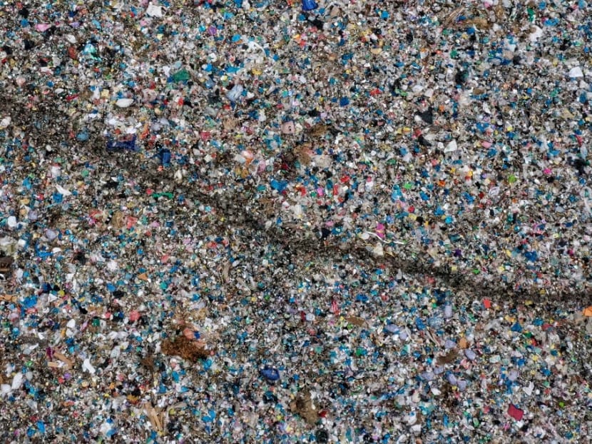 This aerial photo taken on June 5, 2021 shows plastic waste at a collection site in Alue Lim village in Lhokseumawe, Indonesia's Aceh province.