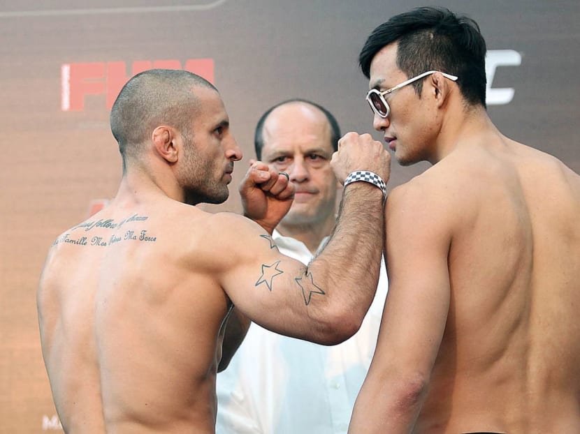 The last time UFC held an event in Singapore was in 2014, when MMA fighters Tarec Saffiedine (left) and Lim Hyun Gyu headlined a welterweight bout at the UFC Fight Night. TODAY File Photo