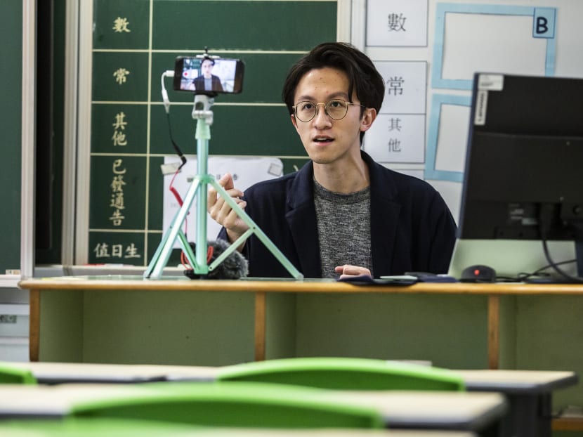 Primary school teacher Billy Yeung records a video lesson for his students who have had their classes suspended due to Covid-19 in his empty classroom in Hong Kong.