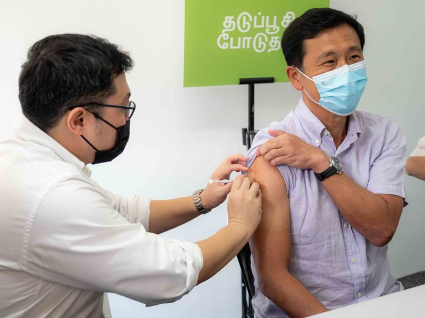 Health Minister Ong Ye Kung (right) receiving the Moderna-Spikevax bivalent Covid-19 vaccine from Dr Ong Guan Hong, medical director of Pancare Medical, on Oct 11, 2022.