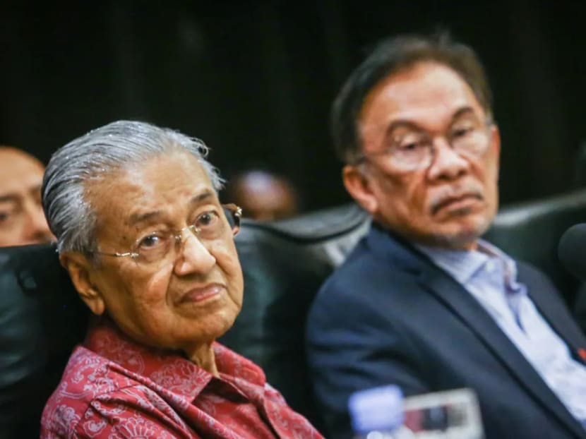 Dr Mahathir Mohamad (left) stood by his insistence that Mr Anwar Ibrahim (right) would be the person to succeed him.