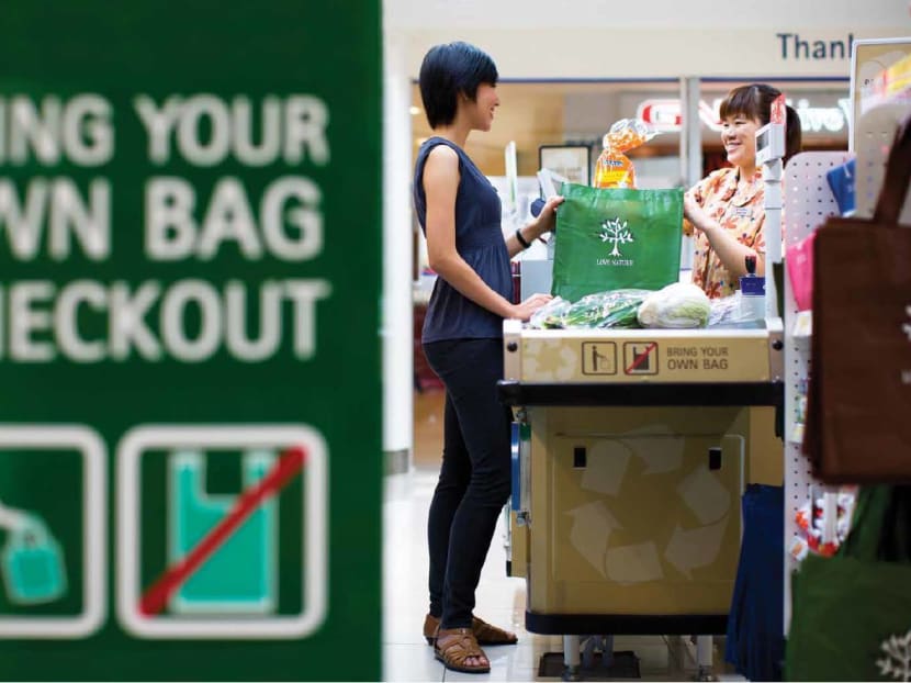 NTUC FairPrice has been encouraging customers to bring their own bags and enjoy a 10-cent discount on a minimum purchase of S$10 since 2007. Greater incentives could encourage more Singaporeans to make a habit of bringing their own bags when they go shopping, says the author.  Photo: NTUC Fairprice Facebook page