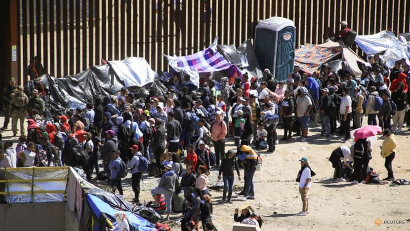 Hundreds of migrants amass near US-Mexico wall with COVID-19 ban set to end