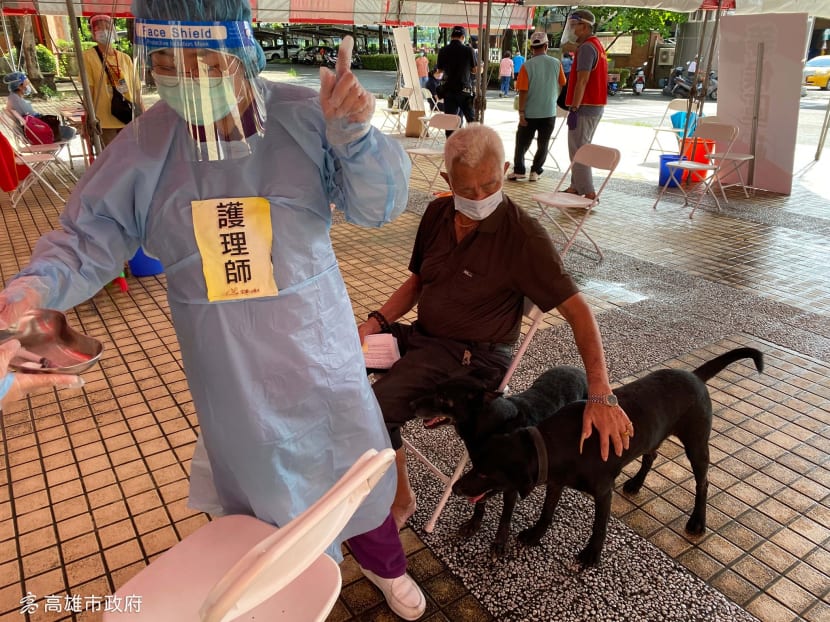 Two dogs in Kaohsiung, Taiwan, accompanied their elderly owner to a Covid-19 vaccination centre.