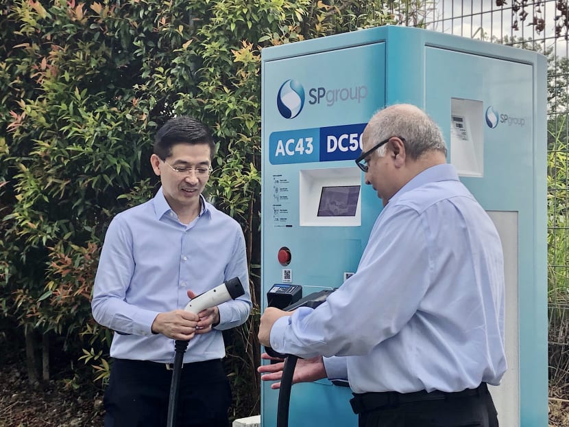 Mr Wong Kim Yin, Group chief executive officer of SP Group (left), and Mr Manohar Khiatani, Deputy Group CEO of Ascendas-Singbridge Group (right), at the demonstration of the high-speed electric vehicle charging points at the Hyflux Innovation Centre on Jan 21.