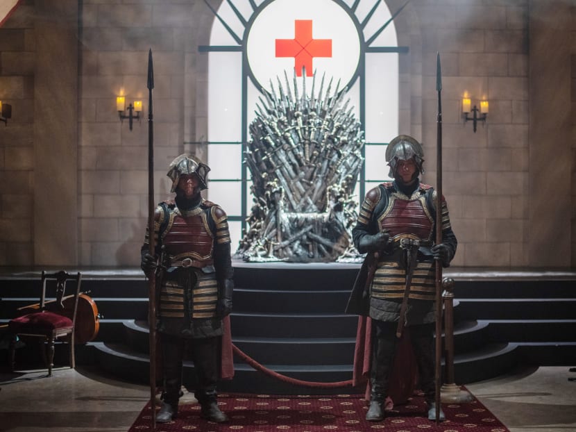 Actors portraying knights guard the Iron Throne at an interactive Game Of Thrones installation, at the South by Southwest (SXSW) conference and festivals in Austin, Texas. A study has shown that pirated files of the popular series are the most at risk of carrying malware.