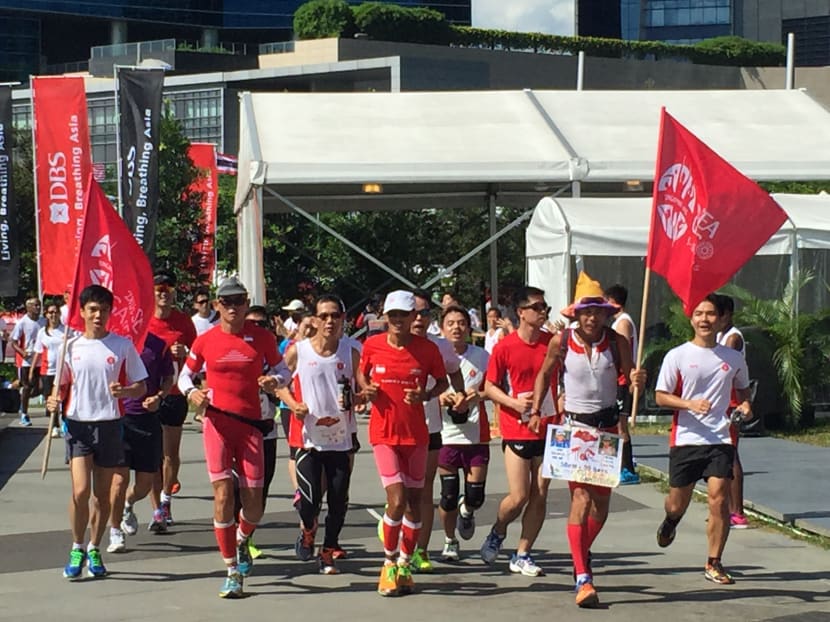 Ultramarathoners carry flame for SEA Games torch