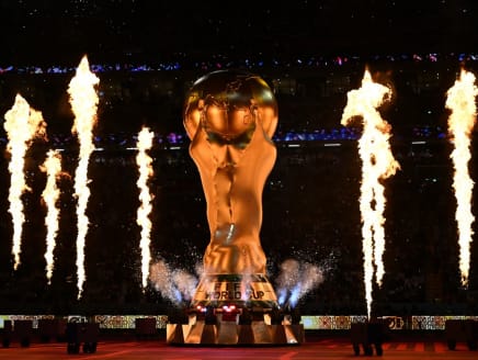 Fireworks explode around a replica of the Fifa World Cup trophy during the opening ceremony ahead of the Qatar 2022 World Cup Group A football match between Qatar and Ecuador at the Al-Bayt Stadium in Al Khor, north of Doha on Nov 20, 2022.
