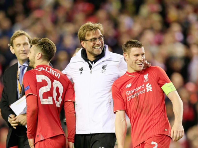Liverpool manager Jurgen Klopp (centre) celebrating with James Milner (right) and Adam Lallana after defeating Villarreal on Thursday. Photo: AP