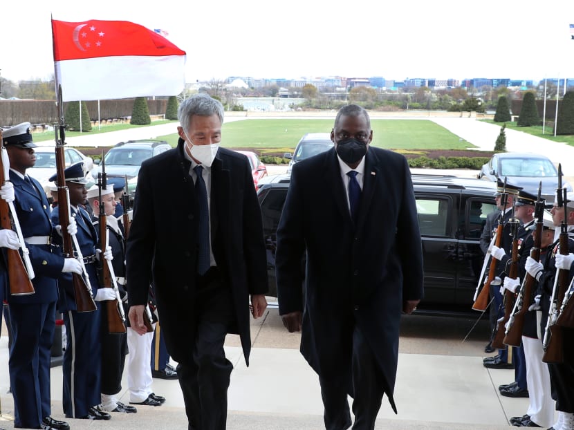 Prime Minister Lee Hsien Loong (left) walking alongside US Defence Secretary Lloyd Austin at the Pentagon on March 28, 2022.