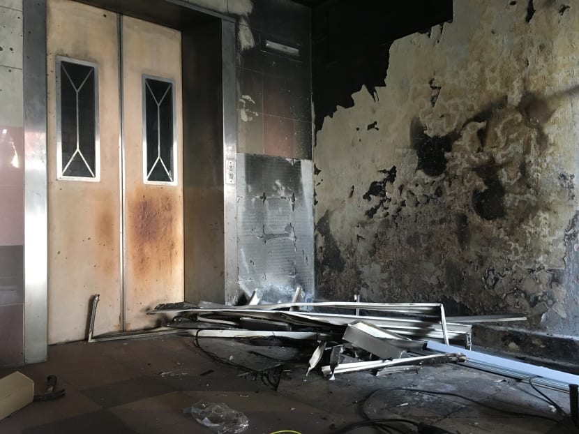 Photo of the day: Burnt walls can be seen after a fire broke out at level 8 of Block 5, Toa Payoh Lorong 7 on Monday (Feb 12). Photo: Najeer Yusof/ TODAY