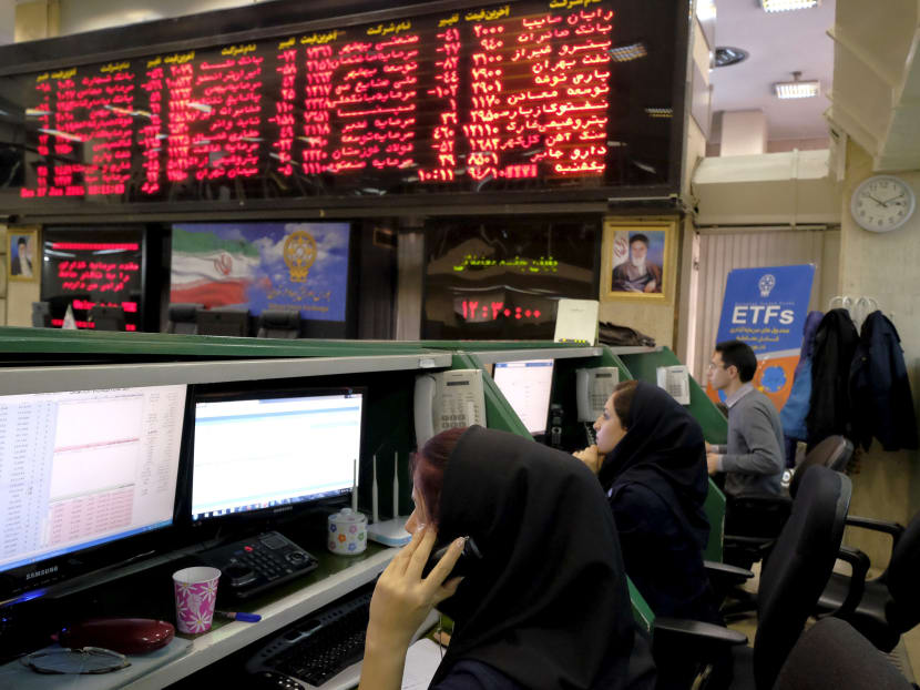 Stock market employees work at Tehran's Stock Exchange in Tehran, Iran, Jan 17, 2015. Photo: Reuters
