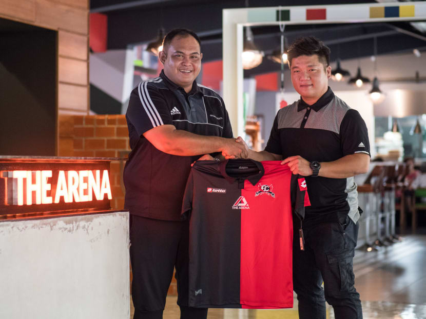 Eunos Crescent FC's Darwin Jalil with Simon Tan (right), the managing director of The Arena. Photo: The Arena