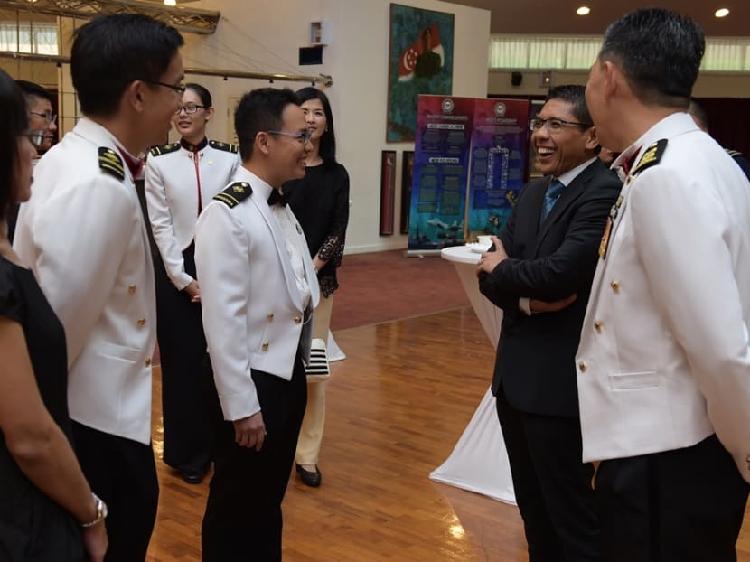 Dr Maliki (second from right) interacting with the graduands at the Senior Military Experts Appointment Ceremony at SAFTI Military Institute. Photo: Mindef