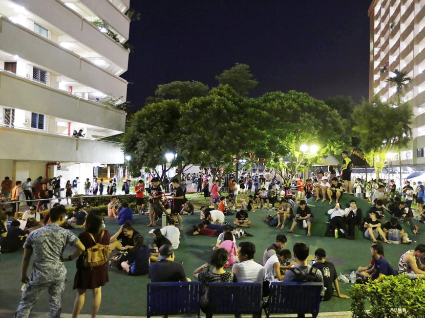 Gamers playing Pokemon Go at Blk 401,Hougang Ave 10, an area that has become a hotspot for Pokemon hunting since the game was launched. Photo: Wee Teck Hian