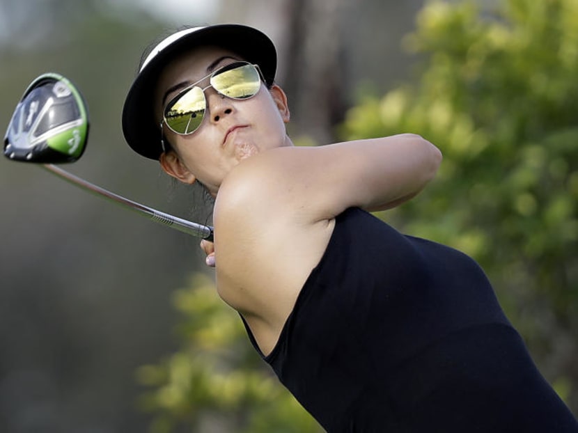 Michelle Wie teeing off on the third hole during the first round of the HSBC Women's Champions golf tournament held at Sentosa Golf Club's Tanjong course. AP