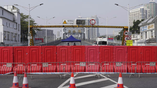 China softens tone on COVID-19 severity after protests