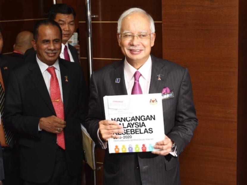 Prime Minister Najib with the 11th Malaysian Plan in Parliament, May 21, 2015. Photo: The Malay Mail Online