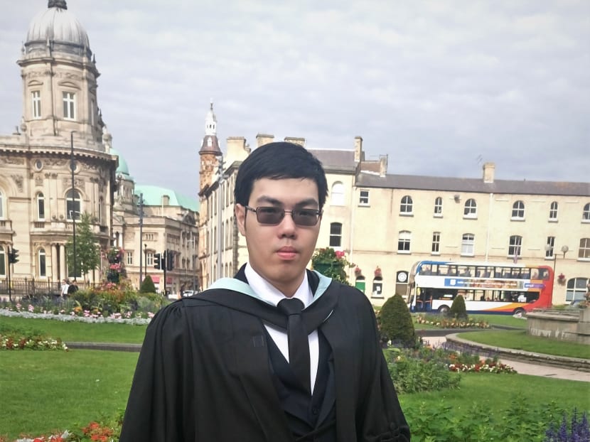 The author, seen here at his graduation ceremony in July 2017, now works 12-hour shifts at Pasir Panjang port terminal.